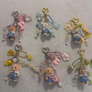 calico critter keychains / nursery babies (pink, blue, green, yellow)