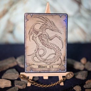 Zilver 1/1, kleurloos wezen, MTG-folietoken