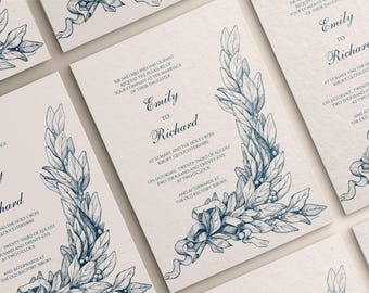 May include: Elegant wedding invitations with a classic design. Each card features a navy blue floral illustration and delicate script. The text reads "Emily to Richard" with event details. The cards are on a cream-colored background.