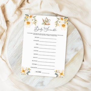 Könnte beinhalten: Ein druckbares Babyparty-Spiel namens "Baby Scramble". Das Spiel fordert die Spieler auf, die babybezogenen Wörter zu entwirren und die Antworten in die Lücken zu schreiben. Die Person mit den meisten richtigen Wörtern gewinnt.