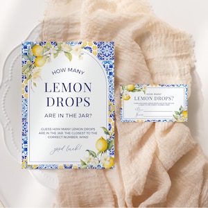 May include: A blue and white tiled card with a lemon illustration and the text "How many lemon drops are in the jar?"  Guess how many lemon drops are in the jar. The closest to the correct number wins! Good luck!