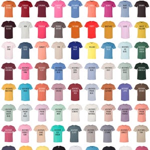 May include: Color chart for unisex adult t-shirts. The chart shows a variety of colors, including burnt orange, canvas red, cardinal, charity pink, columbia blue, coral, berry, baby blue, brown, oxblood black, ash, fuchsia, pebble brown, autumn, poppy, mustard, lilac, maize yellow, soft pink, steel blue, sunset, tan, team navy, yellow, ocean blue, heather ice blue, heather grass green, heather cardinal, heather charity pink, heather clay, heather columbia blue, heather cool grey, heather dust, heather dusty blue, emerald, heather mustard, heather aqua, heather orange, heather orchid, heather canvas red, heather prism blue, heather autumn, heather lapis, heather brown, heather prism dusty blue, heather prism ice blue, heather prism lilac, heather prism mint, heather cement, heather prism natural, heather prism peach, heather prism purple, heather prism sunset, heather raspberry, heather bubble gum, heather sand dune, heather sea green, heather slate, heather stone, heather storm, heather sunset, heather tan, heather midnight navy, heather yellow gold, heather yellow, solid black blend, solid white blend, turquoise, vintage black, vintage white, heather raspberry.