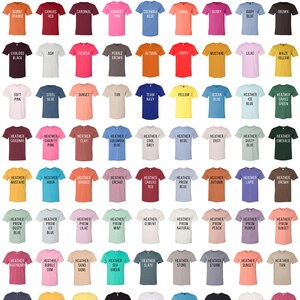 May include: Color chart for unisex adult t-shirts. The chart shows a variety of colors, including burnt orange, canvas red, cardinal, charity pink, columbia blue, coral, berry, baby blue, brown, oxblood black, ash, fuchsia, pebble brown, autumn, poppy, mustard, lilac, maize yellow, soft pink, steel blue, sunset, tan, team navy, yellow, ocean blue, heather ice blue, heather grass green, heather cardinal, heather charity pink, heather clay, heather columbia blue, heather cool grey, heather dust, heather dusty blue, emerald, heather mustard, heather aqua, heather orange, heather orchid, heather canvas red, heather prism blue, heather autumn, heather lapis, heather brown, heather prism dusty blue, heather prism ice blue, heather prism lilac, heather prism mint, heather cement, heather prism natural, heather prism peach, heather prism purple, heather prism sunset, heather raspberry, heather bubble gum, heather sand dune, heather sea green, heather slate, heather stone, heather storm, heather sunset, heather tan, heather midnight navy, heather yellow gold, heather yellow, solid black blend, solid white blend, turquoise, vintage black, vintage white, heather raspberry.