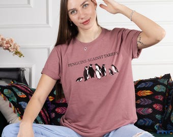 Penguins Against Tariffs Graphic T-shirt,Funny Penguin Shirt, Eco Friendly Cute Animal Shirt,Unisex Gift for Nature Lovers &Protest Fans Tee