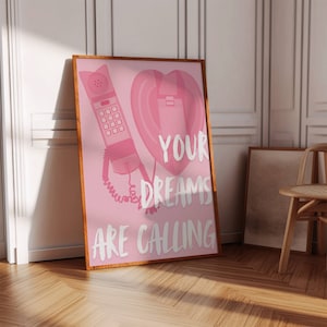 May include: Pink and white poster with a pink rotary phone and a heart-shaped phone receiver. The text on the poster reads "Your Dreams Are Calling."