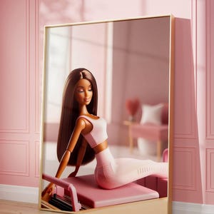 May include: A doll with long brown hair wearing a pink sports bra and leggings is sitting on a pink pilates reformer in a pink room.