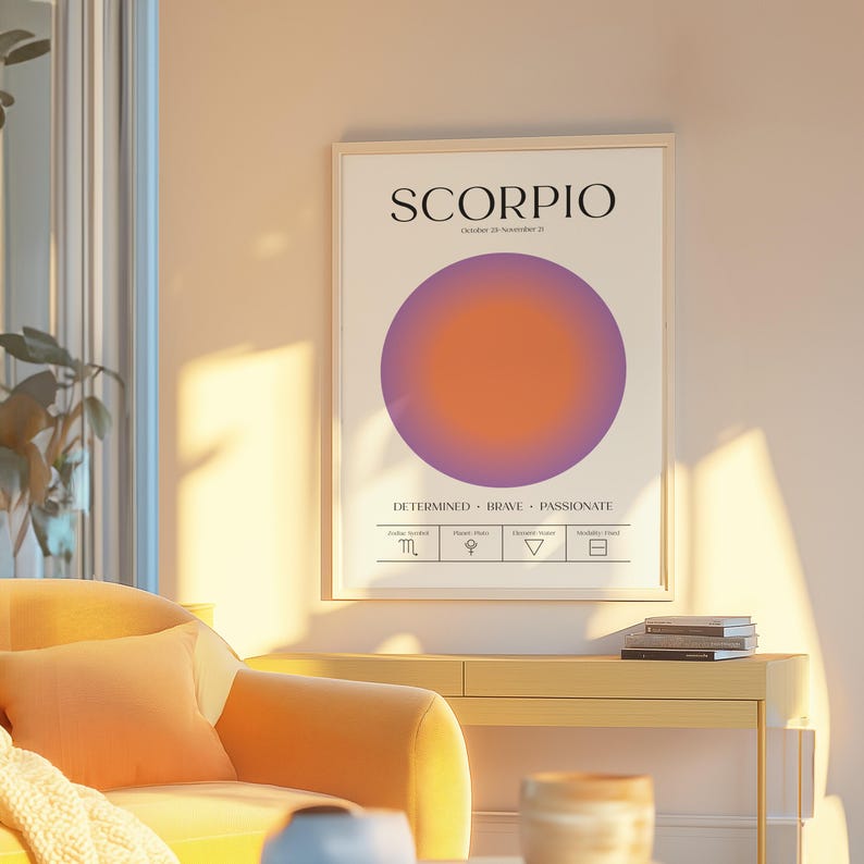 May include: A framed art print featuring the word "SCORPIO" above a gradient circle in shades of purple and orange. The print includes the dates October 23 - November 21 and the words "DETERMINED BRAVE PASSIONATE".