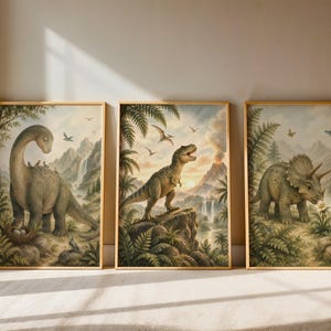 May include: A set of three framed wall art prints featuring prehistoric dinosaur scenes. The first shows a long-necked dinosaur with birds, the second a theropod near a volcano, and the third a triceratops in a lush, fern-filled landscape.