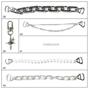 May include: A collection of silver-toned chain accessories. Includes a chunky chain, a delicate chain, a pearl strand, and a pearl chain. Also features a keychain with a star charm. The text "COMING SOON" is also visible.