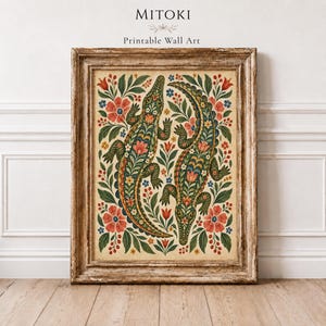 May include: A framed wall art print featuring two green crocodiles surrounded by intricate floral patterns in red, blue, and green. The text MITOKI Printable Wall Art is centred above the rectangular frame, which has a weathered wood finish.