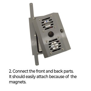 May include: A grey metal box with a fan and a switch. The box is open and the front and back parts are separated. The back part has a fan and a switch. The front part has a filter. The two parts are connected by magnets.