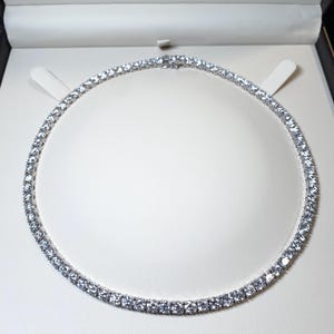 30ctw lab grown graduated tennis necklace in 14k white gold 16 inches. E-F color Vvs-Vs clarity.