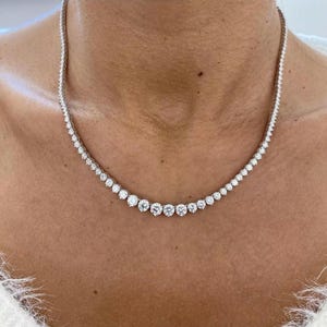 10ct lab grown graduated tennis necklace in 14k white gold 16 inches. E-F color Vvs-Vs clarity.