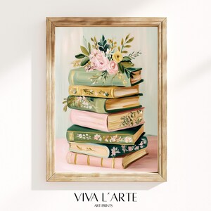 May include: A framed art print featuring a stack of books in shades of green, pink, and gold, adorned with a floral arrangement of pink and yellow flowers. The artwork has a vintage aesthetic, with the text "VIVA L'ARTE ART PRINTS" at the bottom.
