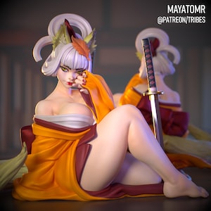 May include: A figurine of a woman in a yellow and maroon kimono, with white hair and a decorative headpiece. She is seated, with a katana sword behind her. The text "MAYATOMR @PATREON/TRIBES" is visible.