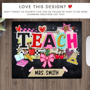 May include: A black mousepad with the word "TEACH" in colorful letters, decorated with school-themed graphics like an apple, scissors, and a pink bow. The name "MRS. SMITH" is printed at the bottom.
