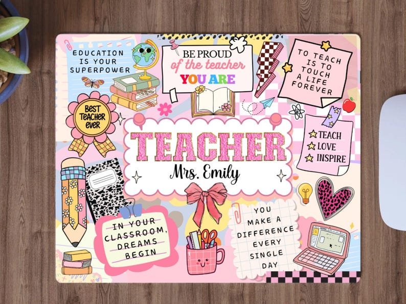 May include: A personalised teacher's desk mat with a pink and pastel design. The mat features the word "TEACHER" in large pink letters, the name "Mrs. Emily", and various school-themed graphics and inspirational quotes. The mat is rectangular.