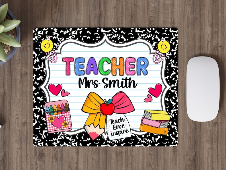 May include: A rectangular mousepad with a black and white composition notebook paper design. The mousepad features the word "TEACHER" in colorful bubble letters, the name "Mrs. Smith", and school-themed graphics like a pencil, apple, and books.