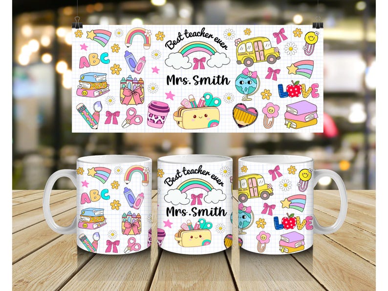 May include: White ceramic mug with a colorful teacher-themed design. The design includes rainbows, school buses, pencils, and the text "Best teacher ever Mrs. Smith". The mug is on a wooden surface.