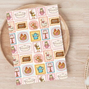 May include: A rectangular card featuring a repeating pattern of illustrations including geese, chickens in baskets, teapots, teacups, lamps, and bread boxes labeled with the word BREAD. The design uses a soft color palette of pink, blue, and yellow.