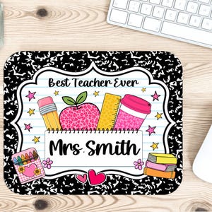 May include: A rectangular mouse pad with a black and white composition notebook pattern border. The center features a white lined paper design with the text Best Teacher Ever and Mrs. Smith, decorated with a pencil, apple, ruler, and cup.