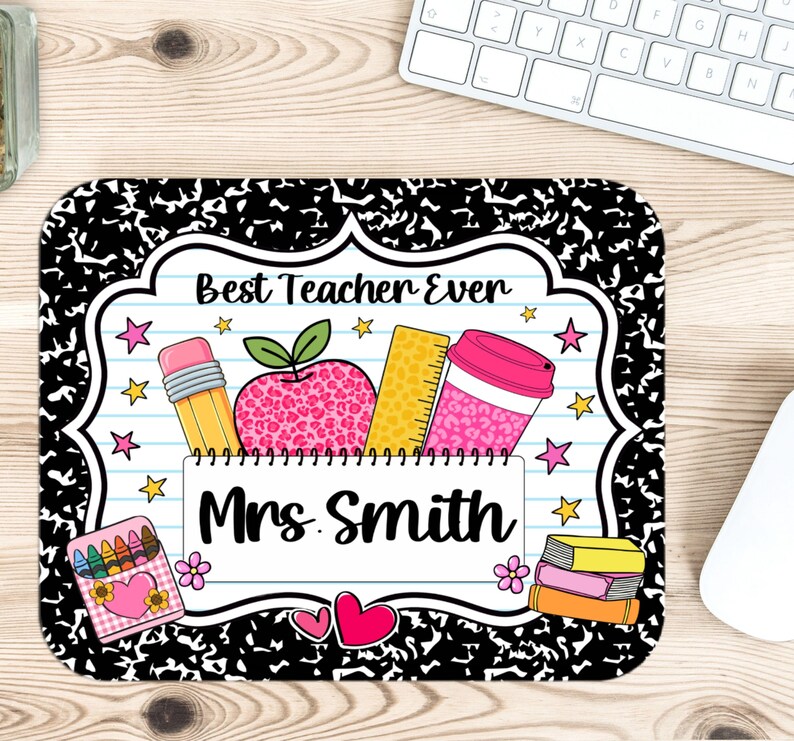 May include: A rectangular mouse pad with a black and white composition notebook pattern border. The center features a white lined paper design with the text Best Teacher Ever and Mrs. Smith, decorated with a pencil, apple, ruler, and cup.