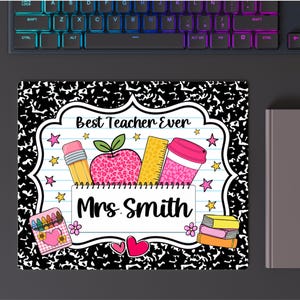 May include: A rectangular mouse pad with a black and white composition notebook pattern border. The center features a white label with the text Best Teacher Ever and Mrs. Smith, decorated with a pencil, leopard print apple, ruler, coffee cup, and crayons.
