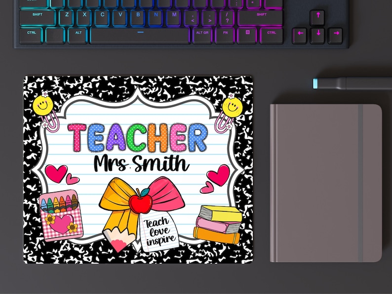 May include: A rectangular mousepad with a composition notebook design. The mousepad features the word "TEACHER" in colorful letters, the name "Mrs. Smith", and school-themed graphics like hearts, pencils, and books. A keyboard and a notebook are in the background.