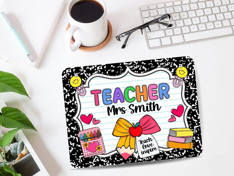 May include: A rectangular mousepad with a black and white notebook paper design. The mousepad features the word "TEACHER" in colorful letters, the name "Mrs. Smith", and school-themed illustrations like a pencil, apple, and books.