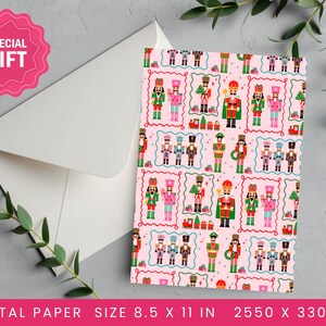May include: A pink digital paper sheet with a repeating pattern of toy soldiers, trains, and Christmas trees. The paper is 8.5 x 11 inches. A white envelope and a pink "Special Gift" sticker are also visible.