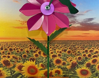 Handcrafted metal Lilly flower. Made from 20 gauge sheet metal and powder coated. Mounted on a stained wood base.