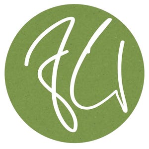 May include: A circular emblem featuring a solid olive green background with a textured, paper-like appearance. Centered on the circle is a stylised, white handwritten monogram consisting of the letters J and U, rendered in a fluid, continuous line.