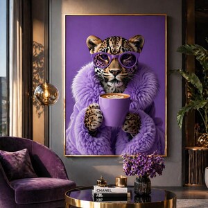 May include: A framed wall art print featuring a leopard wearing purple-rimmed glasses and a fluffy purple faux fur coat, holding a matching purple coffee mug with latte art. The background is a solid, vibrant shade of purple.