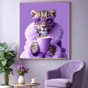May include: A framed wall art print featuring a leopard wearing purple-rimmed glasses and a fluffy purple coat. The leopard is holding a purple mug filled with a warm beverage. The background is a solid purple colour, matching the overall theme.