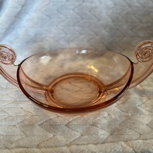 Vintage Fostoria pink glass console bowl featuring a scroll handle design Pink Depression Glass