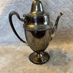 May include: A rustic wooden sign with the text "Welcome to our home" in white lettering. The sign features a distressed finish and a simple, inviting design, perfect for a front porch or entryway.