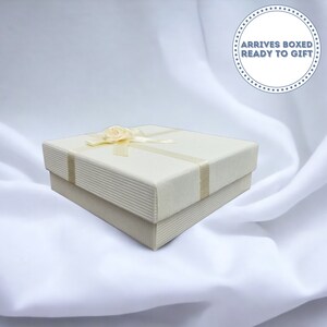 Ivory gift box with satin rose ribbon