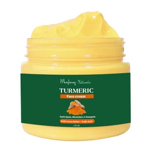 May include: A jar of yellow turmeric face cream. The jar has a green label with the words "TURMERIC Face cream" and the product's benefits. The cream is designed to address dark spots, blemishes, and sunspots. The jar contains 59 ml.