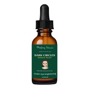 May include: A dark brown glass bottle with a dropper top, labeled "Mafany Naturals Dark Circles Remover Serum". The label is green with white text and a cartoon illustration of an eye with dark circles. The text on the label reads "Suitable for all skin types", "Fades dark circles all over eyes", "Under-eye brightening", and "1/2 FL OZ".
