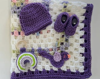 Handmade crochet baby blanket hat booties and  baby rattle toy gift set.  Purple  white Crochet Baby Blanket with bird applique