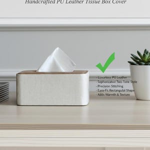 Rectangular PU leather tissue box cover with linen‑style beige texture and stitched wooden top, designed to fit standard Kleenex rectangular boxes. Features a modern, minimalist look that blends seamlessly with home décor styles from contemporary to boho. Durable magnetic closure allows easy tissue replacement, while the elegant design makes it perfect for bathroom, bedroom, living room, or office use. A stylish and functional home accessory or thoughtful gift idea.