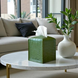 Contemporary napkin holder, tissue box organizer, tissue dispenser, tissue box protector, napkin organizer, bathroom decor accessories, leather storage box, square tissue box holder, woven design, facial tissue cover, crocodile leather tissue dispenser, square tissue box protector.