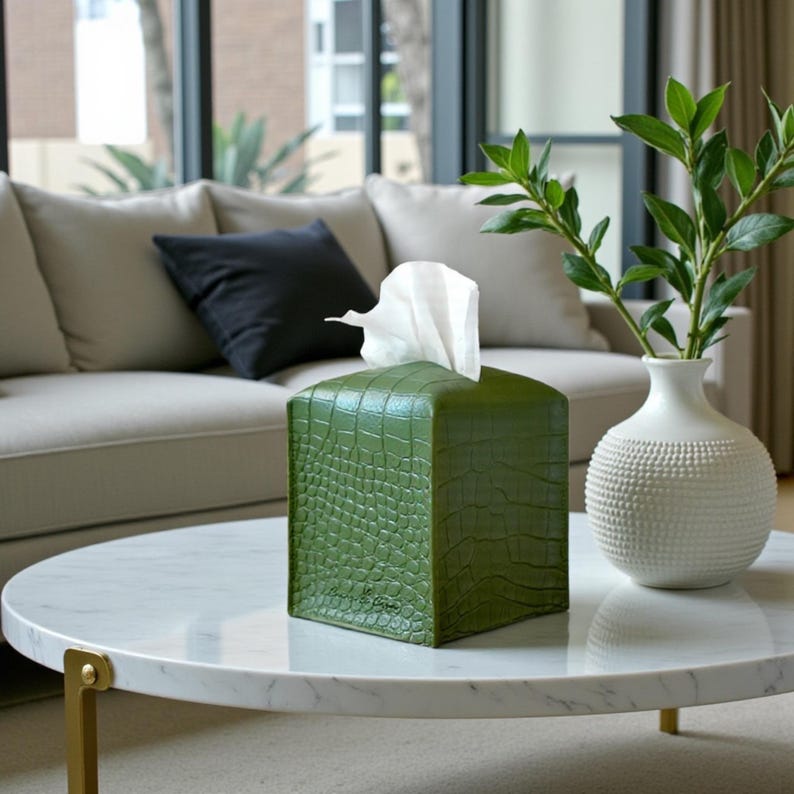 Contemporary napkin holder, tissue box organizer, tissue dispenser, tissue box protector, napkin organizer, bathroom decor accessories, leather storage box, square tissue box holder, woven design, facial tissue cover, crocodile leather tissue dispenser, square tissue box protector.