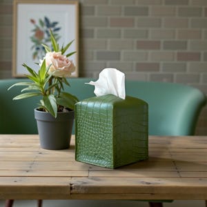 Contemporary napkin holder, tissue box organizer, tissue dispenser, tissue box protector, napkin organizer, bathroom decor accessories, leather storage box, square tissue box holder, woven design, facial tissue cover, crocodile leather tissue dispenser, square tissue box protector.
