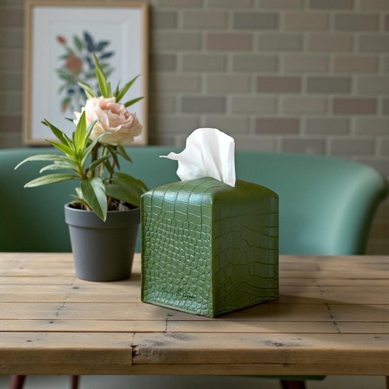 Contemporary napkin holder, tissue box organizer, tissue dispenser, tissue box protector, napkin organizer, bathroom decor accessories, leather storage box, square tissue box holder, woven design, facial tissue cover, crocodile leather tissue dispenser, square tissue box protector.