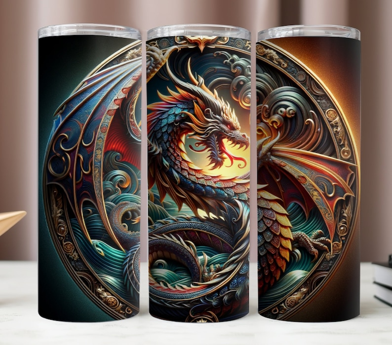 May include: A set of three stainless steel insulated tumblers. Each tumbler features a detailed dragon design with vibrant colors, including blue, red, and gold, set against a dark background. The dragon is framed within an ornate circular border.