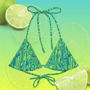 May include: A green and blue patterned bikini top with tie straps. The bikini top has a unique swirl design and is set against a lime-themed background. The top is a triangle style.