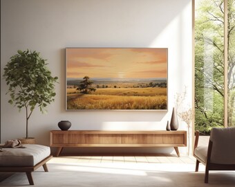 May include: A wooden TV stand with a light wood finish and two drawers. A large framed landscape painting of a field with a tree in the foreground hangs above the stand. The painting has a warm, sunset-like color palette.