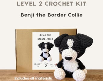 May include: A crochet kit for Benji the Border Collie. The kit includes all materials and 100% wool. The finished product is a black and white crocheted dog with white paws and a white chest. The box reads "LEVEL 2 CROCHET KIT".