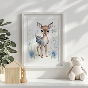 May include: A watercolor painting of a fawn with brown and white spots standing in a field of blue flowers. The fawn is looking directly at the viewer.